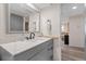 Bathroom with gray vanity and a large mirror at 3142 Pinon Dr, Holiday, FL 34691