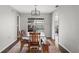 Dining area with wood table, chairs, and view of backyard pool at 3341 Landover Blvd, Spring Hill, FL 34609