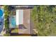 An aerial shot reveals the property's tile roof and enclosed pool area at 465 Meadowlark Ln, Palm Harbor, FL 34683