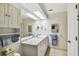 Bright bathroom featuring a large mirror and vanity with lots of storage at 465 Meadowlark Ln, Palm Harbor, FL 34683