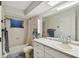 Bright bathroom featuring a tub with shower, and vanity with storage at 465 Meadowlark Ln, Palm Harbor, FL 34683