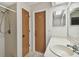 Bathroom with a sink, wood cabinets, shower with curtain, and a mirror at 465 Meadowlark Ln, Palm Harbor, FL 34683