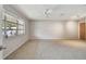Bedroom with a large window allowing natural light, neutral paint color, and a ceiling fan at 465 Meadowlark Ln, Palm Harbor, FL 34683