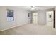 Bedroom featuring neutral carpet, walk-in closet, and natural light at 465 Meadowlark Ln, Palm Harbor, FL 34683