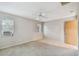 Bedroom featuring neutral colors, natural light, carpeting, and a ceiling fan at 465 Meadowlark Ln, Palm Harbor, FL 34683