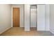 Bedroom featuring a closet with sliding doors and built-in shelving for extra storage at 465 Meadowlark Ln, Palm Harbor, FL 34683