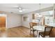 Bright dining area with wood floors and kitchen views at 465 Meadowlark Ln, Palm Harbor, FL 34683