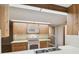 Bright kitchen with wood cabinets and white appliances at 465 Meadowlark Ln, Palm Harbor, FL 34683