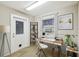 Cozy office space with natural light, featuring a modern desk and shelving at 465 Meadowlark Ln, Palm Harbor, FL 34683