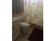 Clean bathroom with single vanity and decorative shower curtain at 4901 Onyx Ln # 202, New Port Richey, FL 34652
