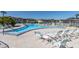 Inviting pool area with lounge chairs and a refreshing pool for relaxation at 4901 Onyx Ln # 202, New Port Richey, FL 34652