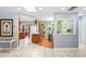 Kitchen and dining area with breakfast bar and light wood floors at 5200 Quintilis St, Spring Hill, FL 34608