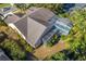 Aerial view of house, pool, and backyard at 5211 Karlsburg Pl, Palm Harbor, FL 34685