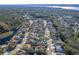 Aerial view of house and neighborhood at 5211 Karlsburg Pl, Palm Harbor, FL 34685