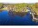 Aerial view of waterfront park, boat ramp, and dock at 5211 Karlsburg Pl, Palm Harbor, FL 34685