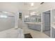 Bright bathroom with corner soaking tub and double vanity at 5211 Karlsburg Pl, Palm Harbor, FL 34685