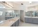 Large bathroom with a corner tub and double vanities at 5211 Karlsburg Pl, Palm Harbor, FL 34685