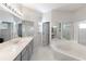 Spacious bathroom with a large soaking tub and double vanity at 5211 Karlsburg Pl, Palm Harbor, FL 34685