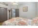 Bright bedroom with a double bed and access to another room at 5211 Karlsburg Pl, Palm Harbor, FL 34685