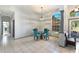 Breakfast nook with a round glass table and teal chairs at 5211 Karlsburg Pl, Palm Harbor, FL 34685