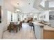 Open concept dining area with kitchen and living room visible at 5211 Karlsburg Pl, Palm Harbor, FL 34685