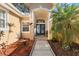 Welcoming front entrance with double doors and a charming walkway at 5211 Karlsburg Pl, Palm Harbor, FL 34685