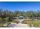 Aerial view of community gazebo with surrounding landscaping at 5211 Karlsburg Pl, Palm Harbor, FL 34685