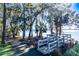 Peaceful lakeside walkway with wooden footbridge and scenic views at 5211 Karlsburg Pl, Palm Harbor, FL 34685