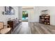 Living area with hardwood floors, pool view, and built-ins at 5211 Karlsburg Pl, Palm Harbor, FL 34685