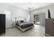 Main bedroom with king-size bed and access to backyard pool at 5211 Karlsburg Pl, Palm Harbor, FL 34685
