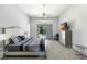 Spacious main bedroom with king bed and private access to pool at 5211 Karlsburg Pl, Palm Harbor, FL 34685
