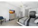 Main bedroom with king-size bed and views to backyard at 5211 Karlsburg Pl, Palm Harbor, FL 34685