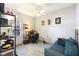 Home office with a comfortable couch and built-in shelving at 5211 Karlsburg Pl, Palm Harbor, FL 34685