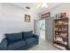 Home office features a couch and built-in shelving at 5211 Karlsburg Pl, Palm Harbor, FL 34685