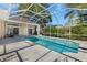 Large screened pool with access from the house at 5211 Karlsburg Pl, Palm Harbor, FL 34685