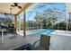 Relaxing screened pool area with patio furniture at 5211 Karlsburg Pl, Palm Harbor, FL 34685