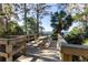 Wooden deck overlooking the lake with a picnic table at 5211 Karlsburg Pl, Palm Harbor, FL 34685