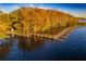 Aerial view of a winding waterfront dock at sunset at 5211 Karlsburg Pl, Palm Harbor, FL 34685