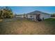 Large backyard with patio, covered pergola and house view at 5324 Dellbrook Ave, Spring Hill, FL 34608
