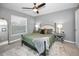 Spacious bedroom with a comfortable bed and plenty of natural light at 5324 Dellbrook Ave, Spring Hill, FL 34608