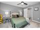 Comfortable bedroom with ensuite bathroom and ceiling fan at 5324 Dellbrook Ave, Spring Hill, FL 34608