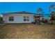 House exterior showcasing backyard patio and landscaping at 5324 Dellbrook Ave, Spring Hill, FL 34608