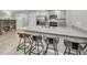 Modern kitchen with breakfast bar and stainless steel appliances at 5324 Dellbrook Ave, Spring Hill, FL 34608