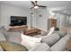 Living area with gray sectional sofa and wood coffee table at 5324 Dellbrook Ave, Spring Hill, FL 34608