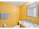 Clean bathroom with granite countertop and yellow walls at 5576 Baywater Dr # 5576, Tampa, FL 33615