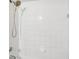 Bathroom with white tiled shower and tub at 5576 Baywater Dr # 5576, Tampa, FL 33615
