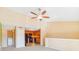 Open living room with high ceilings and a kitchen view at 5576 Baywater Dr # 5576, Tampa, FL 33615