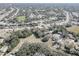 Aerial view of a residential neighborhood showcasing home and street layout at 6470 Treehaven Dr, Spring Hill, FL 34606