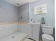 Clean bathroom with shower, sink, and toilet at 7195 Bethesda Ct, Weeki Wachee, FL 34607