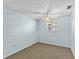 Empty bedroom with light blue walls, ceiling fan and carpet flooring at 7195 Bethesda Ct, Weeki Wachee, FL 34607